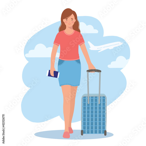 Young woman with a suitcase in her hands, a passport and ticket. The concept of travel, tourism and recreation.