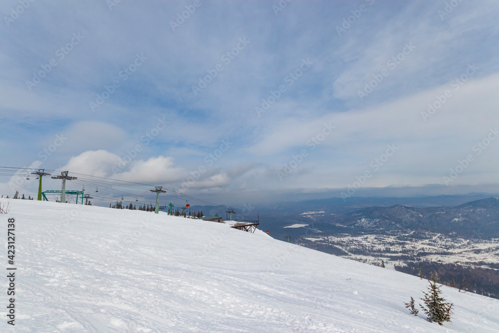 ski slope with mountain lifts 