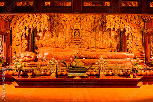 The Wooden Reclining Buddha of Wat Luang Khun Win in Chiangmai Province photo