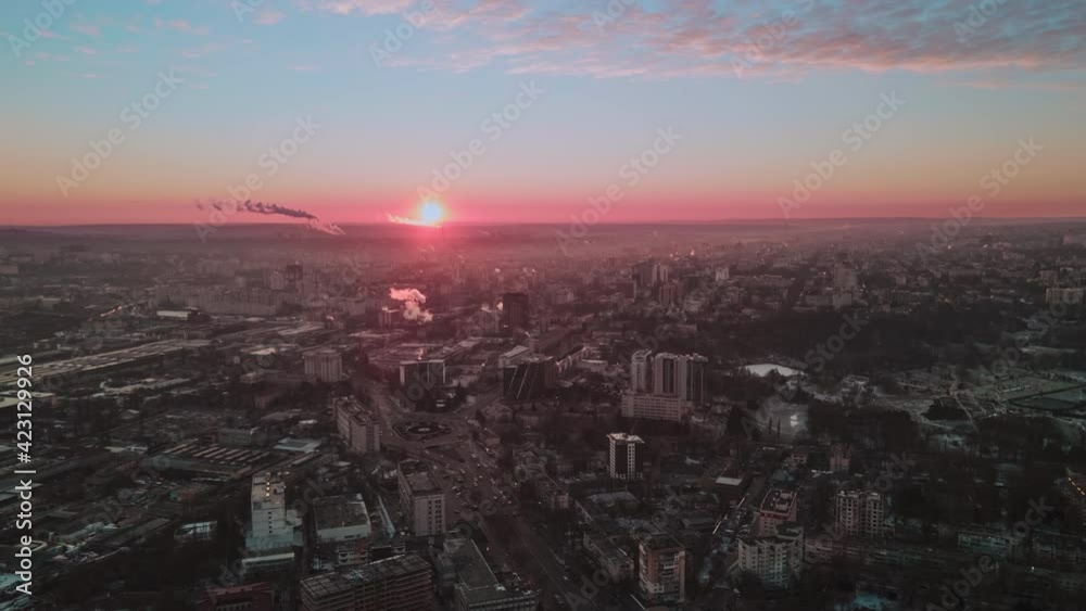 Hyperlapse of Chisinau at sunrise, drone view. Multiple buildings, roads with moving cars, smoke getting off the tubes. Moldova Hyperlapse of Chisinau at sunrise, drone view. Multiple buildings, roads with moving cars, smoke getting off the tubes. Moldova
