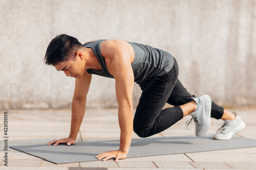 Handsome sportive man doing workout outdoor Handsome sportive man doing workout outdoor