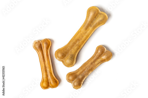 bone for dogs isolated on white background Top view Flat lay Delicious treat for your beloved pet Food for animals concept