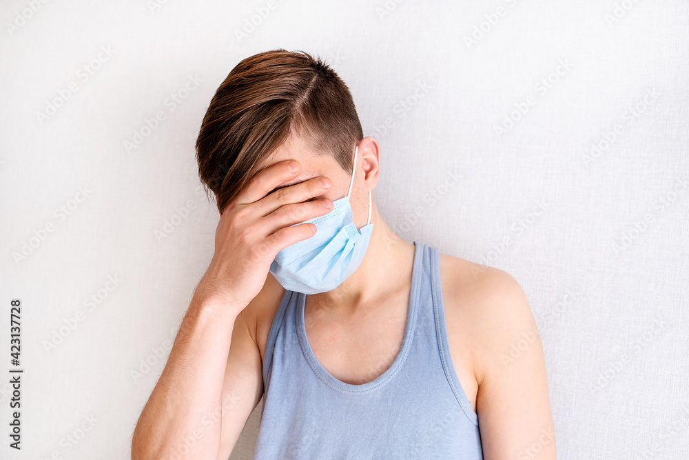 Sad Young Man in a Flu Mask Sad Young Man in a Flu Mask