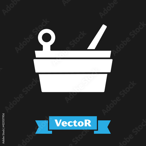 White Sauna bucket and ladle icon isolated on black background. Vector