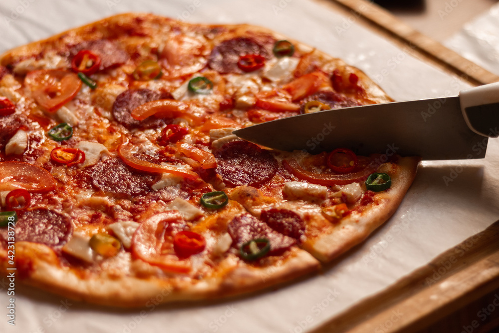 Cutting pizza with a knife