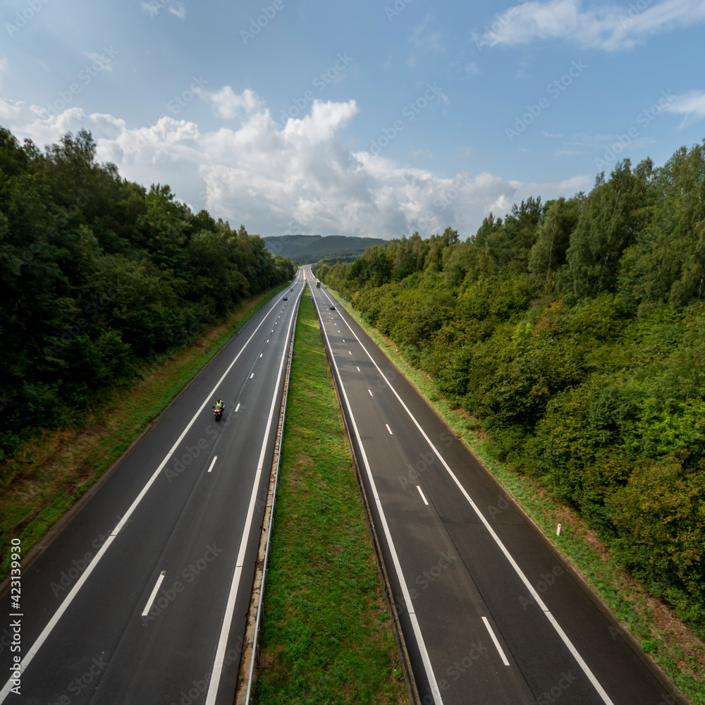 Highway in the Belgian Ardennes. Vertical layout Highway in the Belgian Ardennes. Vertical layout