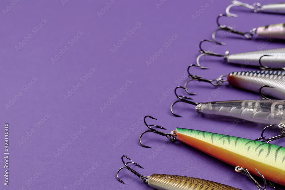 Artificial lures for fishing for predatory fish on a blue backgr