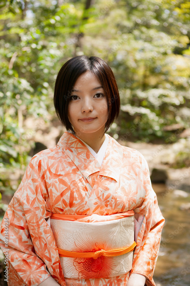 Portrait beautiful young woman in orange kimono
Portrait beautiful young woman in orange kimono