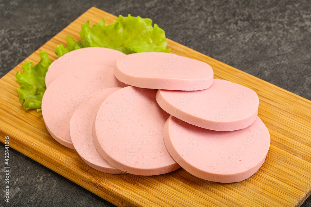 Sliced sausage snak over board