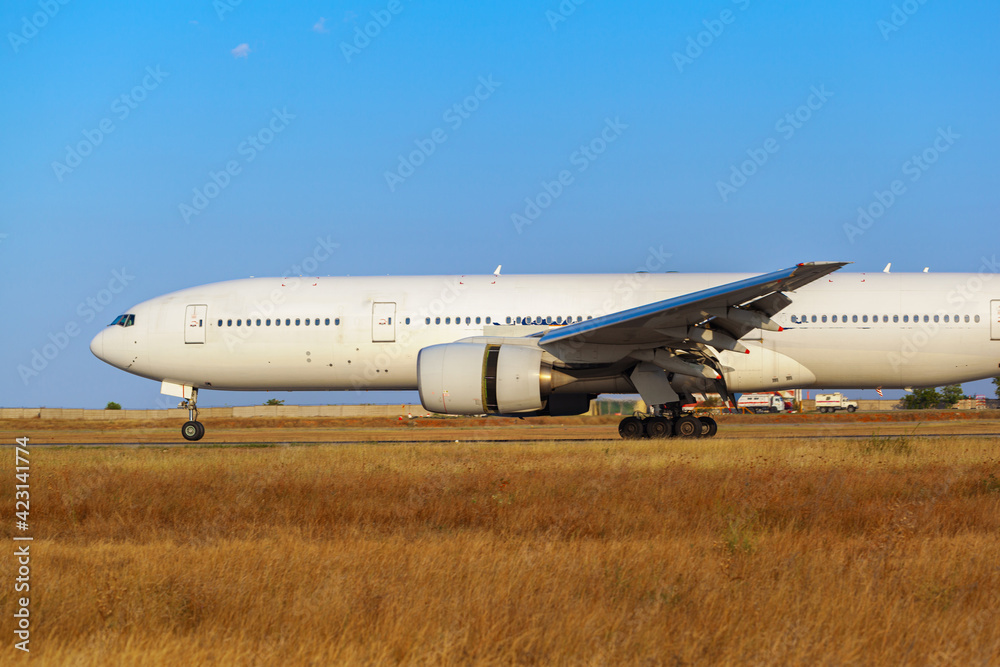 Big passenger airplane drives along the runway in airport Big passenger airplane drives along the runway in airport