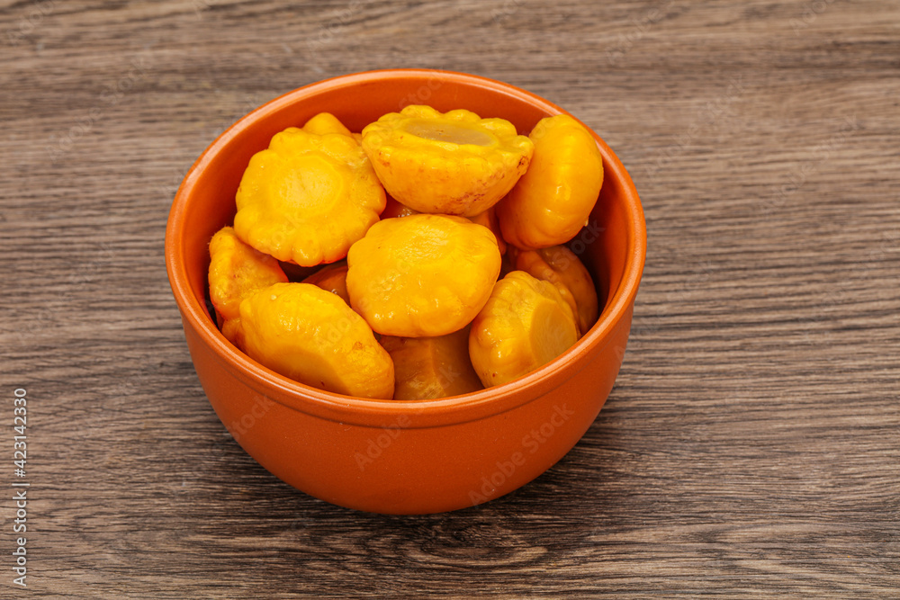 Marinated yellow patisson in the bowl