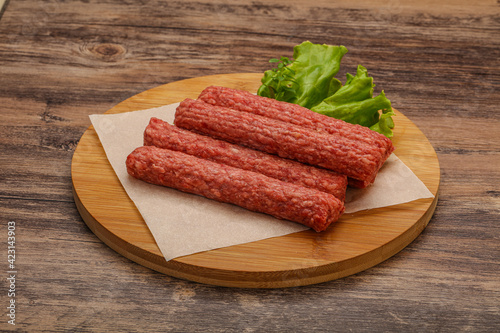 Raw beef sausages with spices