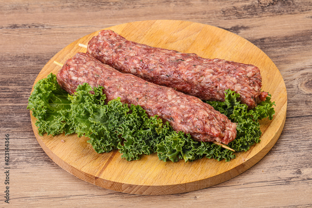 Raw minced beef kebab skewer