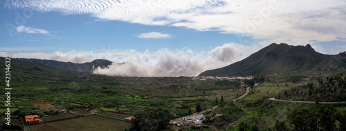 Niebla marina en el sur de la isla de Tenerife, España. Bruma que sube por el Valle de Arriba en Santiago del Teide, pequeño pueblo del sur de la isla. photo