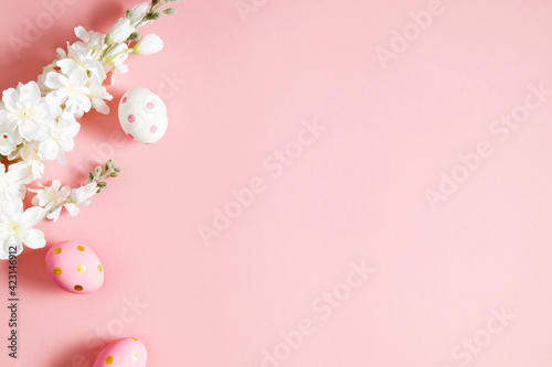 Easter pink composition. Easter eggs on pastel pink background. Minimal concept of Easter. Flat lay  top view  copy space.