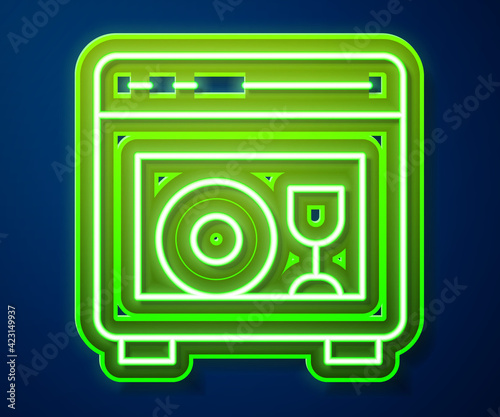 Glowing neon line Kitchen dishwasher machine icon isolated on blue background. Vector