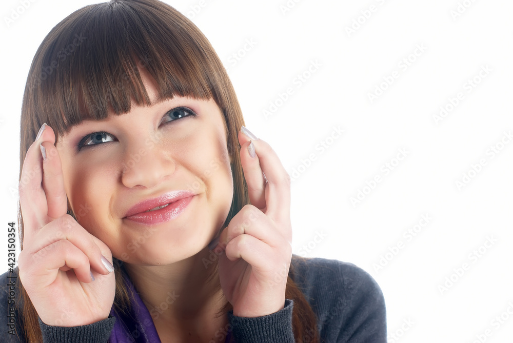 Attractive girl with crossed fingers