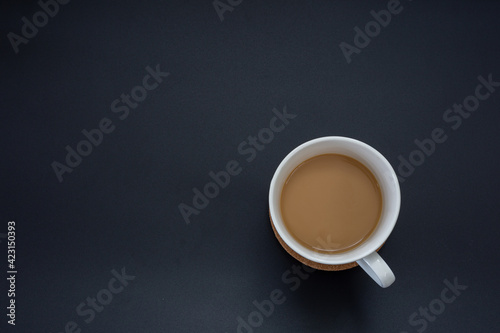 Top view hot coffee cup isolated on black background