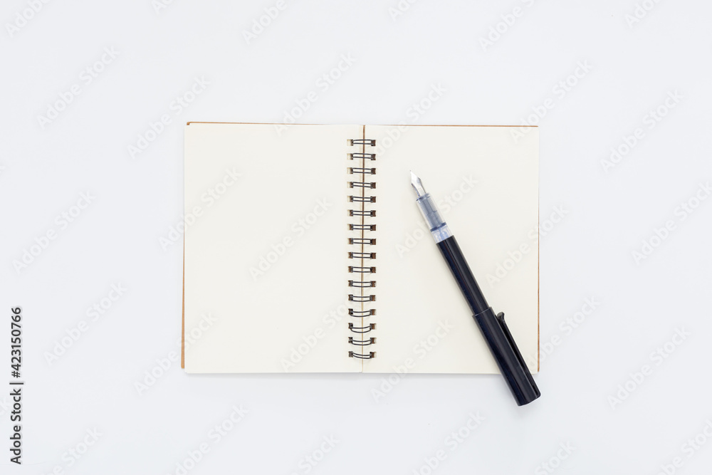 Pen on Notebook isolated on white background Pen on Notebook isolated on white background