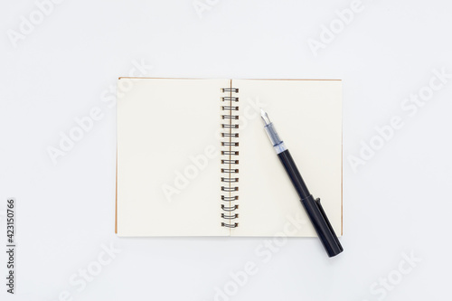 Pen on Notebook isolated on white background