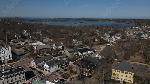 Drone pushes across the scenic downtown shops and streets in Hingham, MA USA - a coastal village south of Boston, MA. Aerial, scenic, low altitude. photo