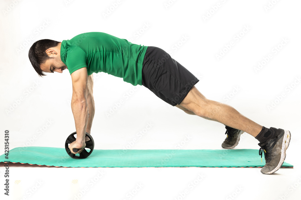 man with Ab roll Bodytone for abdominal strengthening. Small wheel that allows exercises to strengthen the core. on white background..