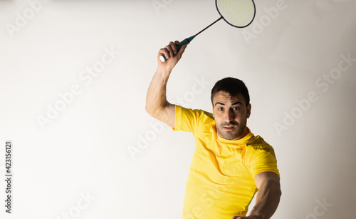 man playing badminton white background