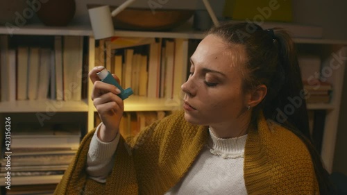 close up woman using asthma pump	