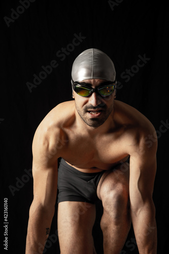 swimming pool man black background