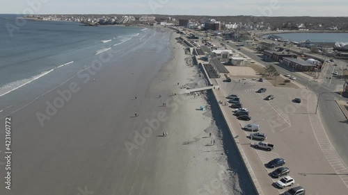 Gentle drone flight over Nantasket Beach, in scenic Hull, MA, USA. Inner bay on right, Atlantic Ocean on left. photo