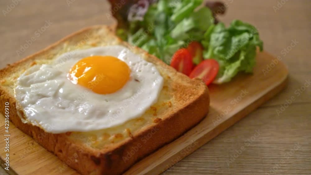 homemade bread toasted with cheese and fried egg on top with vegetable salad for breakfast homemade bread toasted with cheese and fried egg on top with vegetable salad for breakfast