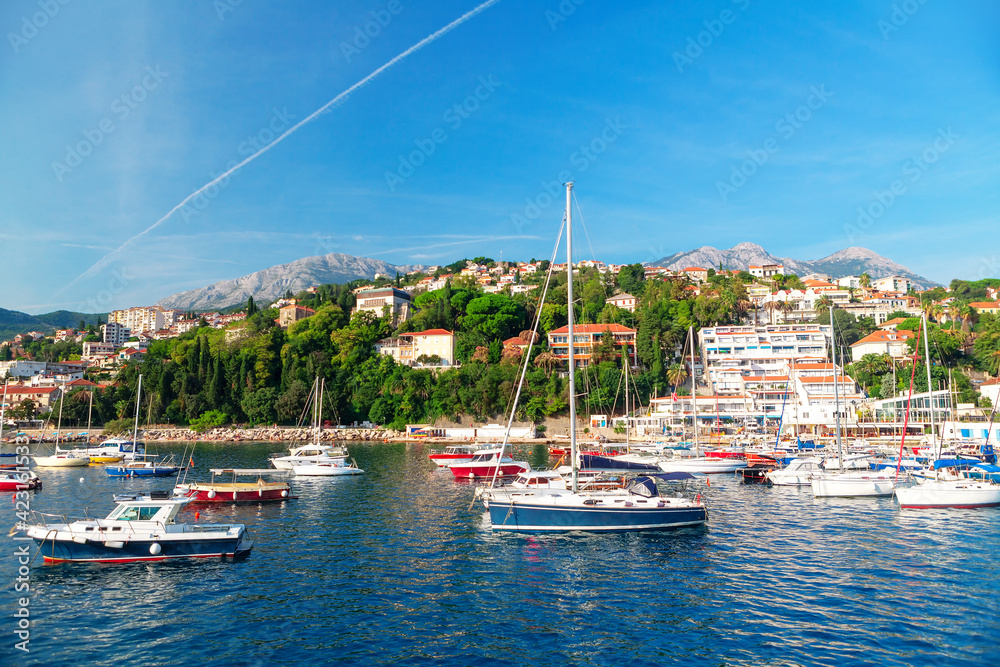  Herceg Novi is coastal town located at the entrance to the Bay of Kotor and at the foot of Mount Orjen in Montenegro . Harbour with yachts in Herceg Novi .Harbour with yachts in Herceg Novi 