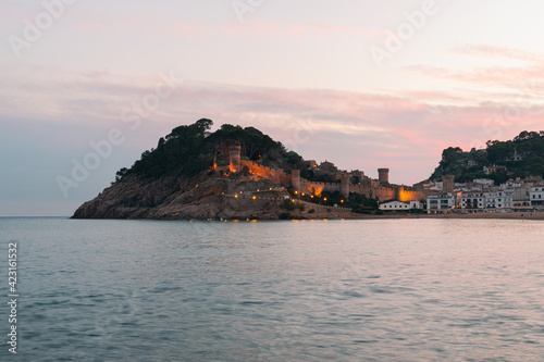 Stone wall and towers of the castle at the Mediterranean sea beach in Tossa de Mar village  Costa Brava  Spain  Europe