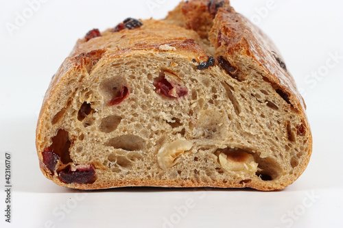 sport bread with nuts cereal grape and cranberry isolated on white  photo