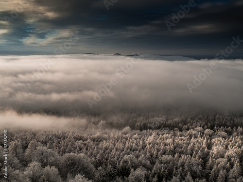 Magnificent view from Watchtower in the mountains during the winter. Land covered by snow, peace in soul during amazing sunset.