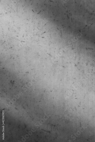 Close-up of marble white wall for background or texture. Light and shadow on stone surface. Black and white photo