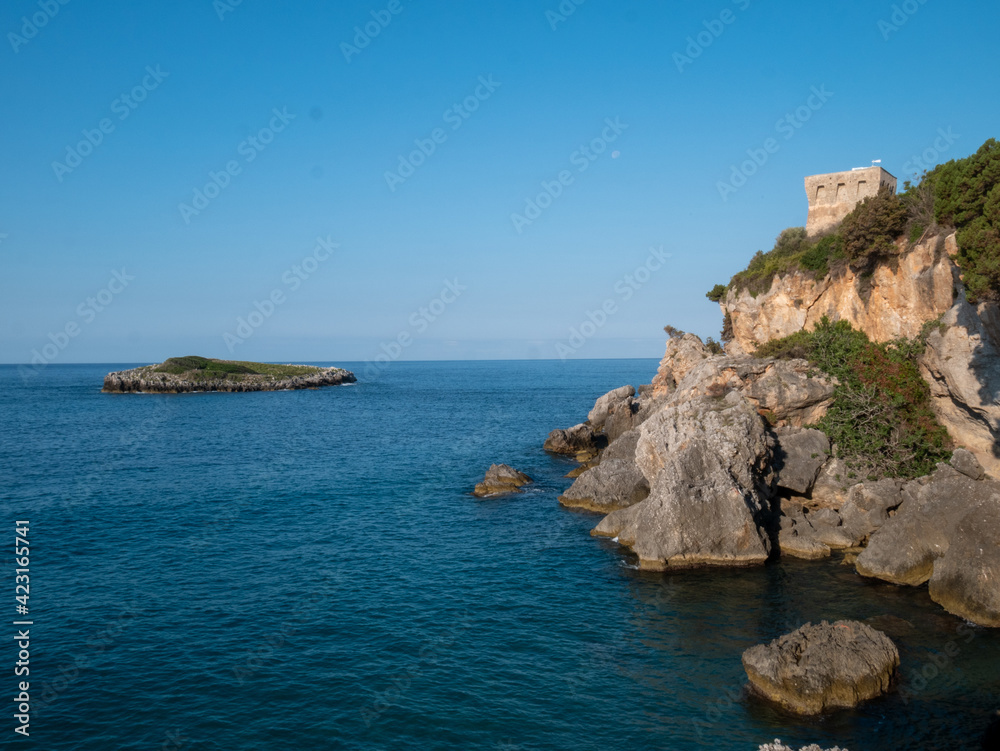 coastal tower and islet on the Tyrrhenian Sea near Marina di Camerota. Cilento and Vallo di Diano National Park, Salerno, Campania, Italy