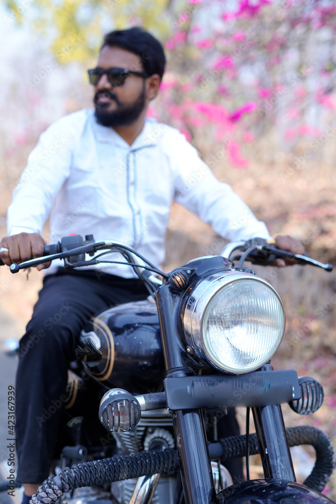 man on a motorbike on the road riding. having fun driving the empty road on a motorcycle tour journey. copy space for your individual text 