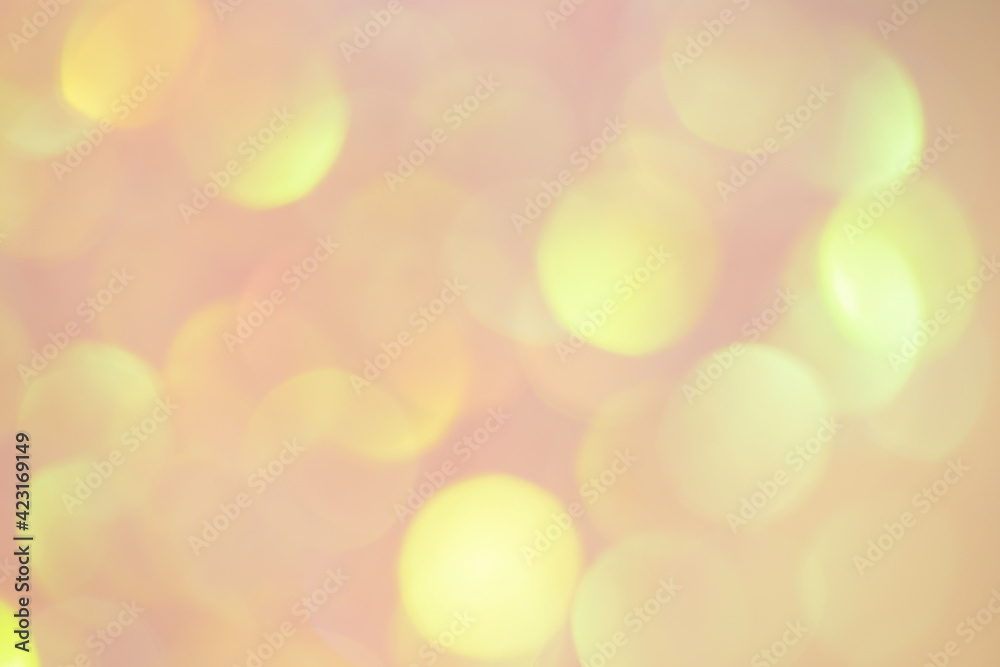 Golden bokeh on pink background. Blurred background. Golden bokeh on pink background. Blurred background.