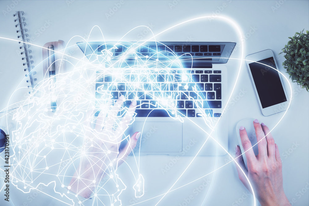 Double exposure of woman hands working on computer and financial theme hologram drawing. Top View. Business concept. Double exposure of woman hands working on computer and financial theme hologram drawing. Top View. Business concept.
