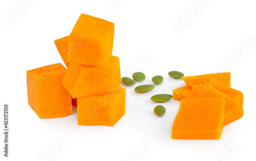 Pumpkin pieces cut in a cube chunks  isolated on white background.