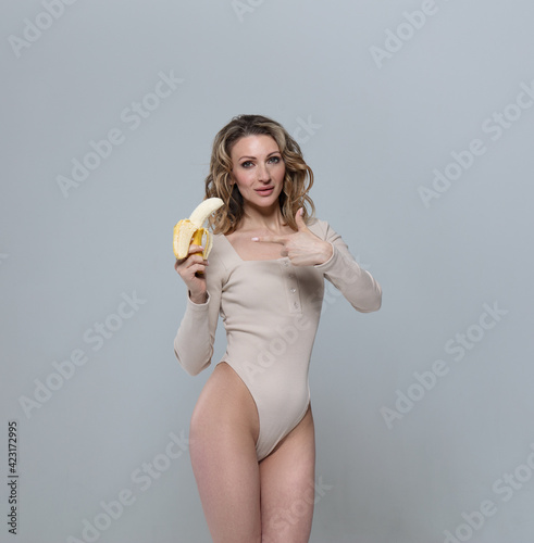 beautiful woman holding a banan