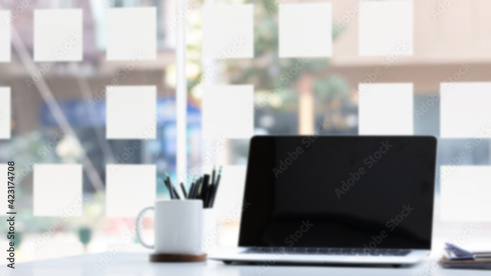 Laptop computer with white blank screen on desk in workspace and copy space concept Laptop computer with white blank screen on desk in workspace and copy space concept