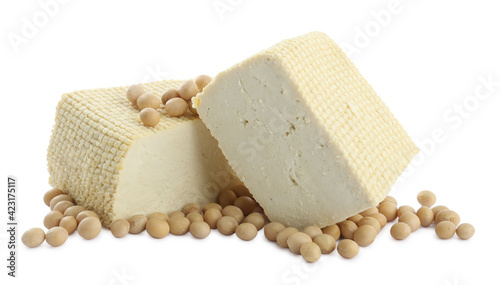 Pieces of delicious tofu and soy on white background