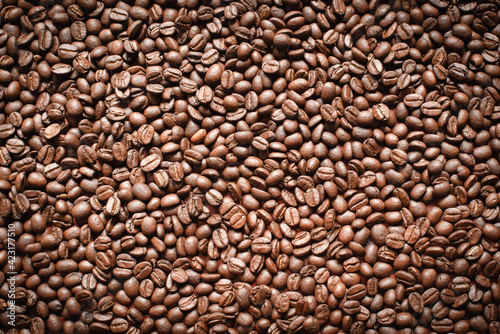 Popular natural food products,freshly roasted Arabica coffee beans background.