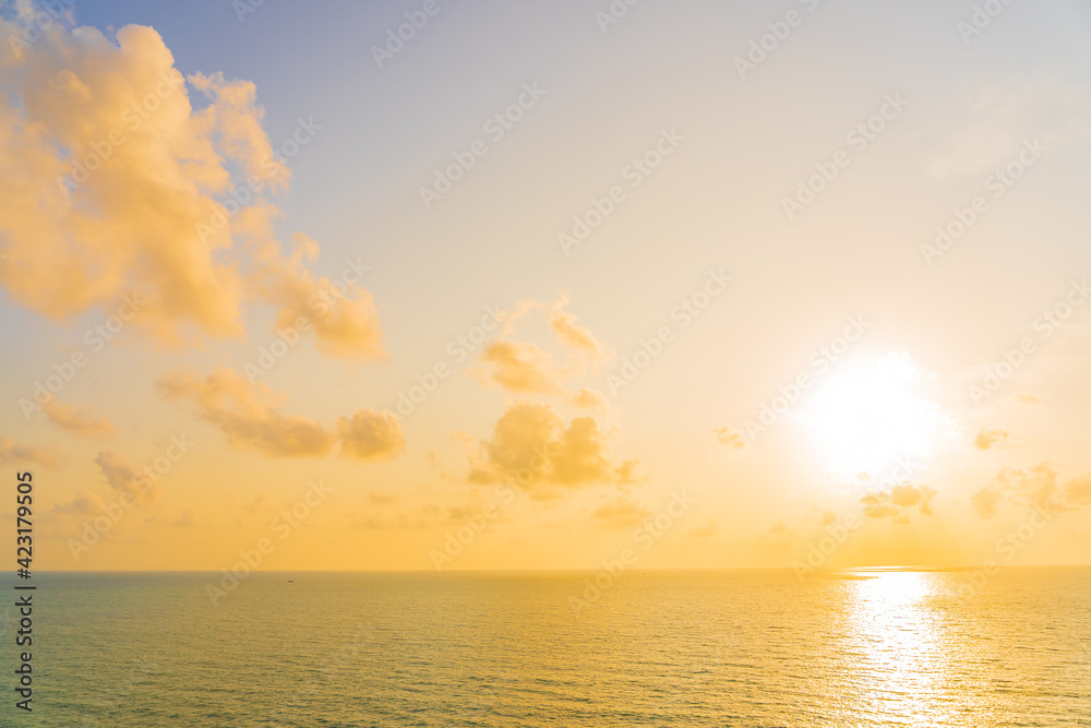 Beautiful tropical beach sea ocean with cloud and sky at sunset or sunrise time