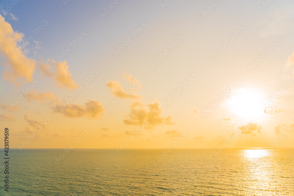 Beautiful tropical beach sea ocean with cloud and sky at sunset or sunrise time
