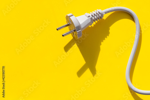 white plug on yellow photo