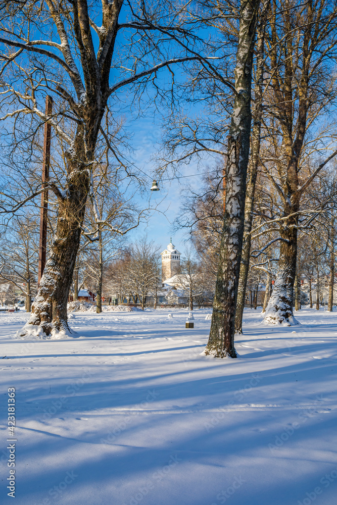 Winter view of the park and church on the background, Tammisaari, Finland Winter view of the park and church on the background, Tammisaari, Finland