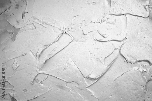 Putty on the wall background. Close-up of a thick layer of putty on the surface. Wall textured surface.